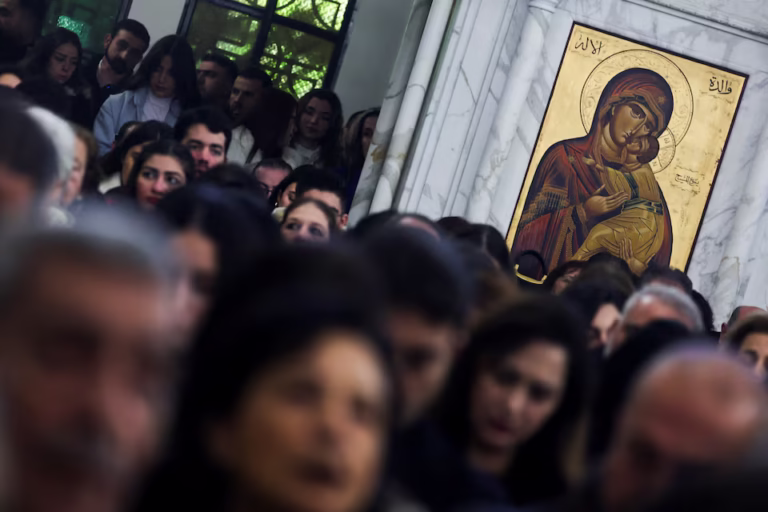 Syrian Christians attending Christmas Mass under tight security in Damascus, marking a historic and uncertain milestone.