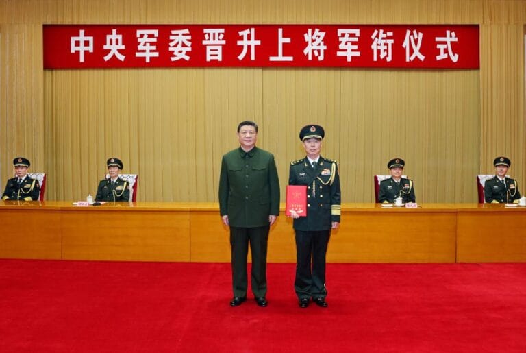Xi Jinping hands General Chen Hui his promotion certificate during a military ceremony in Beijing
