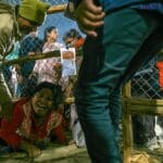 Rescue teams and police carry victims after a deadly stampede at India’s Kumbh Mela festival.