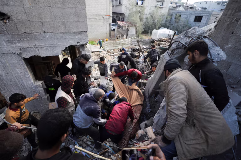 Smoke rises from rubble in Gaza following Israeli airstrikes, with rescuers searching for survivors amid rising tensions.
