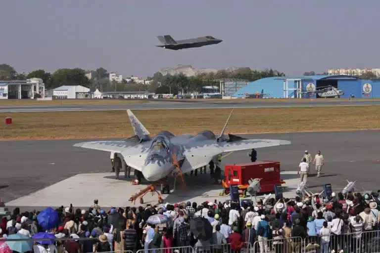 A U.S. F-35 flies over a Russian Su-57 at Aero India 2025, showcasing global military technology.