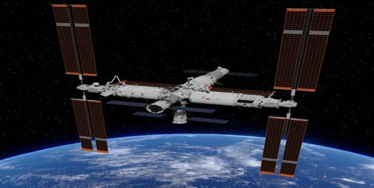 Chinese taikonaut observes station surface where radiation-resistant bacteria strain was discovered on Tiangong Space Station.