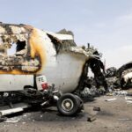 Israeli airstrike explosion damages aircraft on Sanaa Airport tarmac during May 2025 military offensive in Yemen.