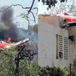 Wreckage of Air India jet lies smoldering near Ahmedabad medical college after deadly crash.