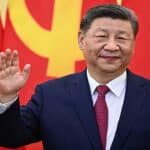 Chinese official and African delegates sign trade agreement to remove tariffs on African imports at summit.