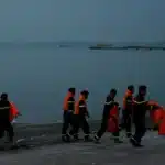 Rescue teams tow capsized Vietnam tourist boat after deadly Ha Long Bay sinking tragedy