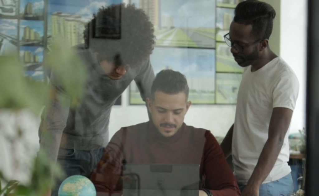 Nigerian using AI creativity tools and digital job platforms on a laptop
