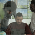 Nigerian using AI creativity tools and digital job platforms on a laptop