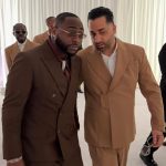 Davido holding hands with a prominent white guest at the CHIVIDO 2025 Miami wedding