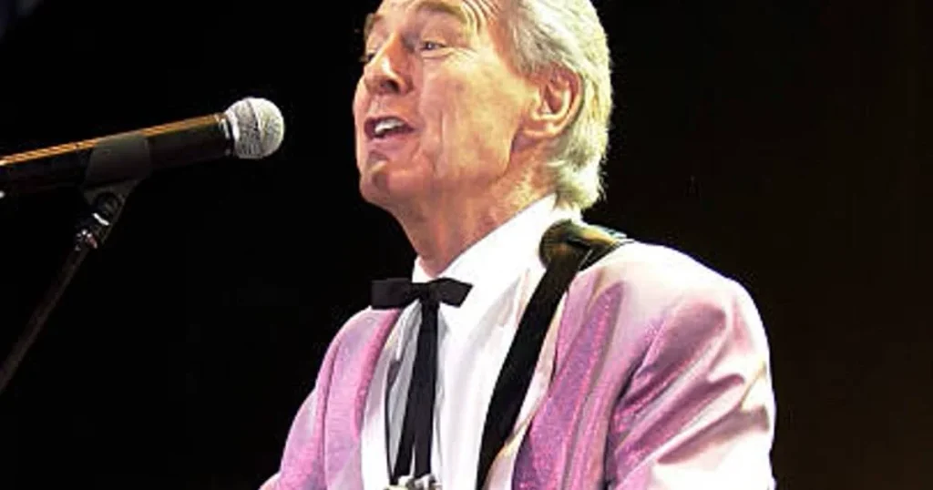 Col Joye, Australian Rock Pioneer, Dies Aged 89 | Epicstorian News Col Joye performs live on stage during the peak of his music career in Australia’s rock and roll era.