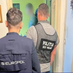 Law enforcement officers conduct Europol-coordinated raid on Albanian cocaine trafficking network during Sky ECC.investigation.