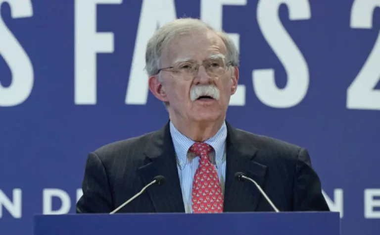 FBI agents conducting a raid at John Bolton’s Bethesda residence
