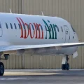 Ibom Air aircraft on runway with crew members boarding flight