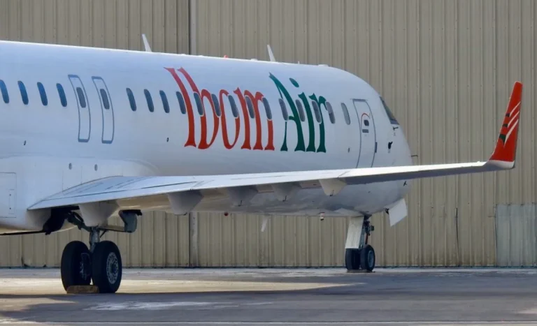 Ibom Air aircraft on runway with crew members boarding flight