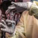 Health workers in DR Congo receive Ebola vaccines during emergency vaccination campaign to contain deadly outbreak in Kasai province.