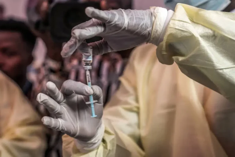 Health workers in DR Congo receive Ebola vaccines during emergency vaccination campaign to contain deadly outbreak in Kasai province.