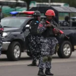 Nigerian police officers escort arrested suspects in Benue after deadly ambush left security personnel dead in Katsina-Ala.