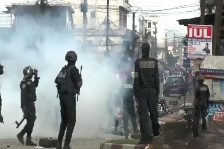 Opposition supporters clash with security forces in Douala during protests over Cameroon presidential election results.