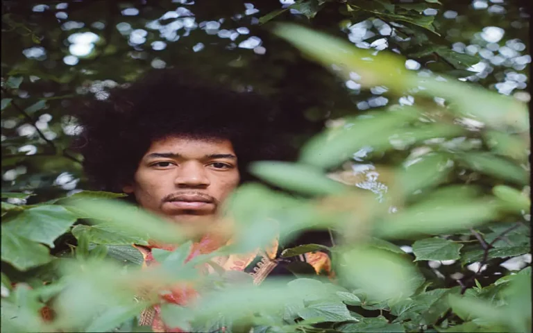 Jimi Hendrix photographed in a Lincoln hotel garden during his first UK tour in April 1967