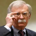 U.S. Justice Department Charges John Bolton After Raid Uncovers Classified Files in Maryland Residence | Epicstorian News John Bolton, Indicted by the U.S. Justice Department October 16, 2025, speaks at NCRI-US conference on Iran’s nuclear agenda in Washington, August 17, 2022.