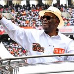 President Alassane Ouattara casts his ballot during Ivory Coast election amid security presence and media coverage.