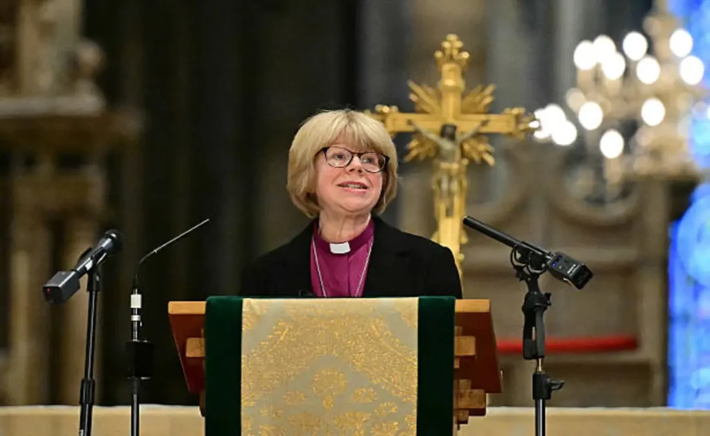 Church of England names Sarah Mullally first female Archbishop of Canterbury after Justin Welby resignation | Epicstorian News Sarah Mullally seated in church, addressing congregation after being appointed first woman Archbishop of Canterbury.