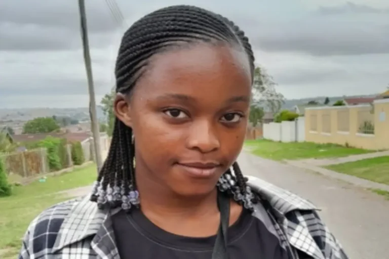 University campus protester holds sign demanding action on gender-based violence amid student safety concerns