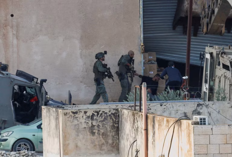 Israeli soldiers positioned during Jenin raid where Two Palestinians were killed after reportedly attempting to surrender unarmed.