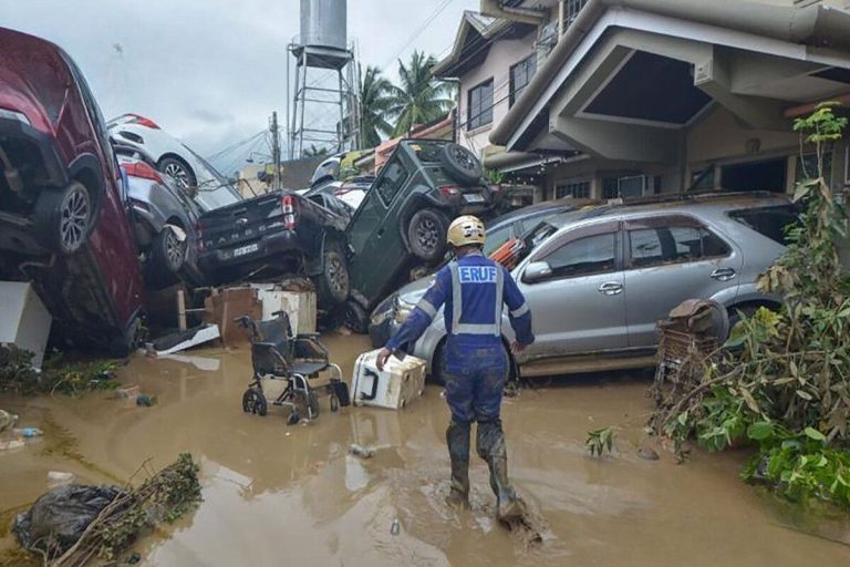 Floodwaters cover vehicles and homes in central Philippines as Typhoon Kalmaegi forces emergency evacuations in Visayas.