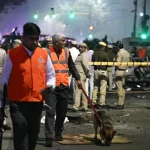 Security officials inspect charred remains of vehicles at Red Fort blast site in India’s capital Delhi.