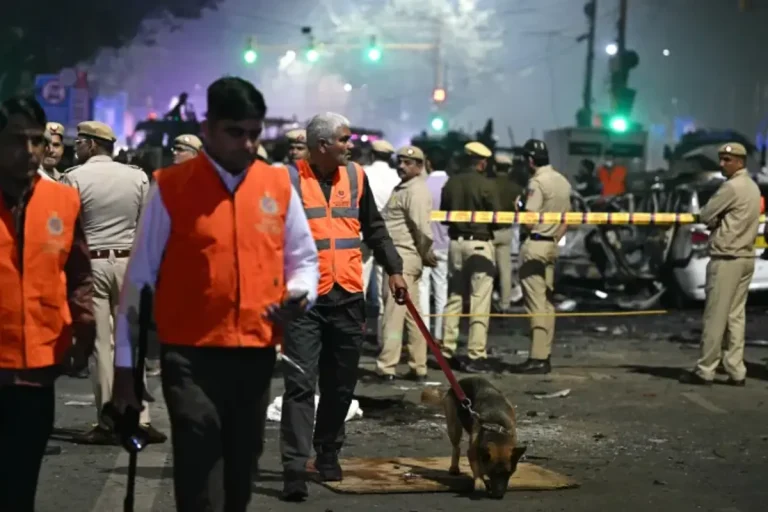Security officials inspect charred remains of vehicles at Red Fort blast site in India’s capital Delhi.