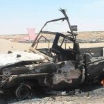 Damaged military vehicles in Mukalla after Saudi airstrikes targeting UAE-backed forces during Yemen conflict.