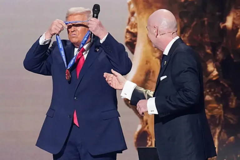 Donald Trump standing on stage at World Cup 2026 draw receiving FIFA Peace Prize at Kennedy Center