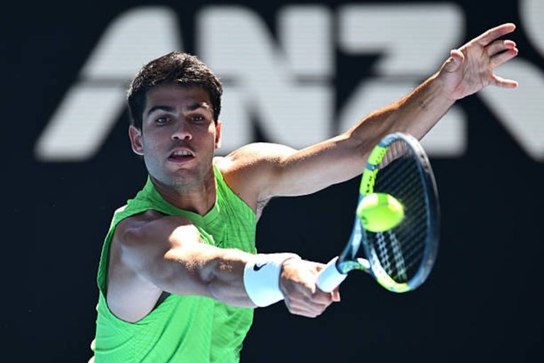Carlos Alcaraz celebrates after beating Alexander Zverev in a marathon Australian Open semifinal at Rod Laver Arena.