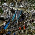 Rescue workers search through debris after a landfill collapse in Cebu City, Philippines, as authorities continue recovery efforts.