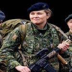 Princess Amalia wearing Dutch military uniform receiving promotion to corporal at General Spoor Barracks, Ermelo, Netherlands.