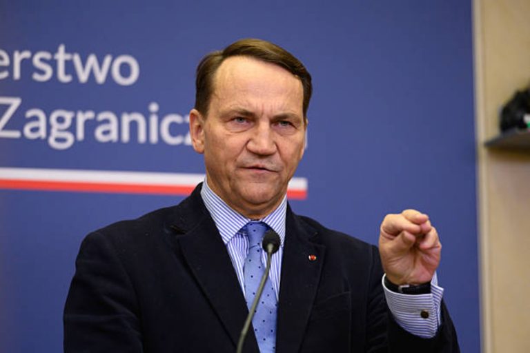 Polish Deputy PM Radosław Sikorski and Czech Foreign Minister Petr Macinka at joint press conference in Warsaw discussing territorial debt, February 16, 2026