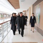 Kim Jong Un stands beside daughter Kim Ju Ae during North Korean rocket launcher test.