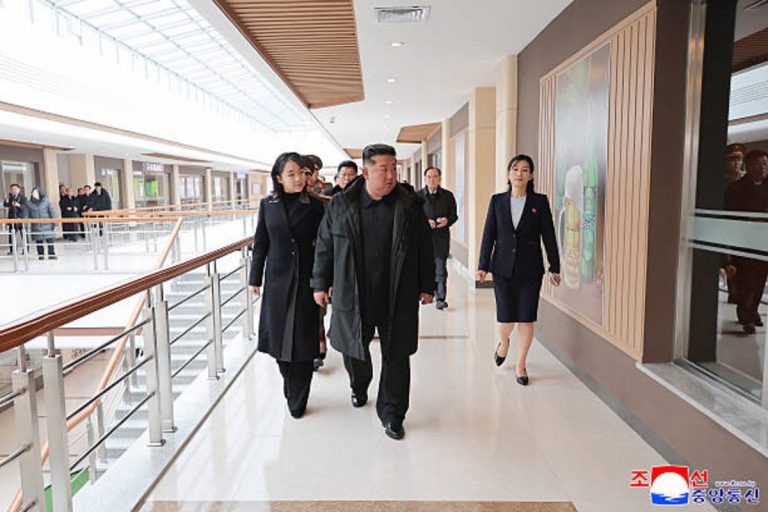 Kim Jong Un stands beside daughter Kim Ju Ae during North Korean rocket launcher test.
